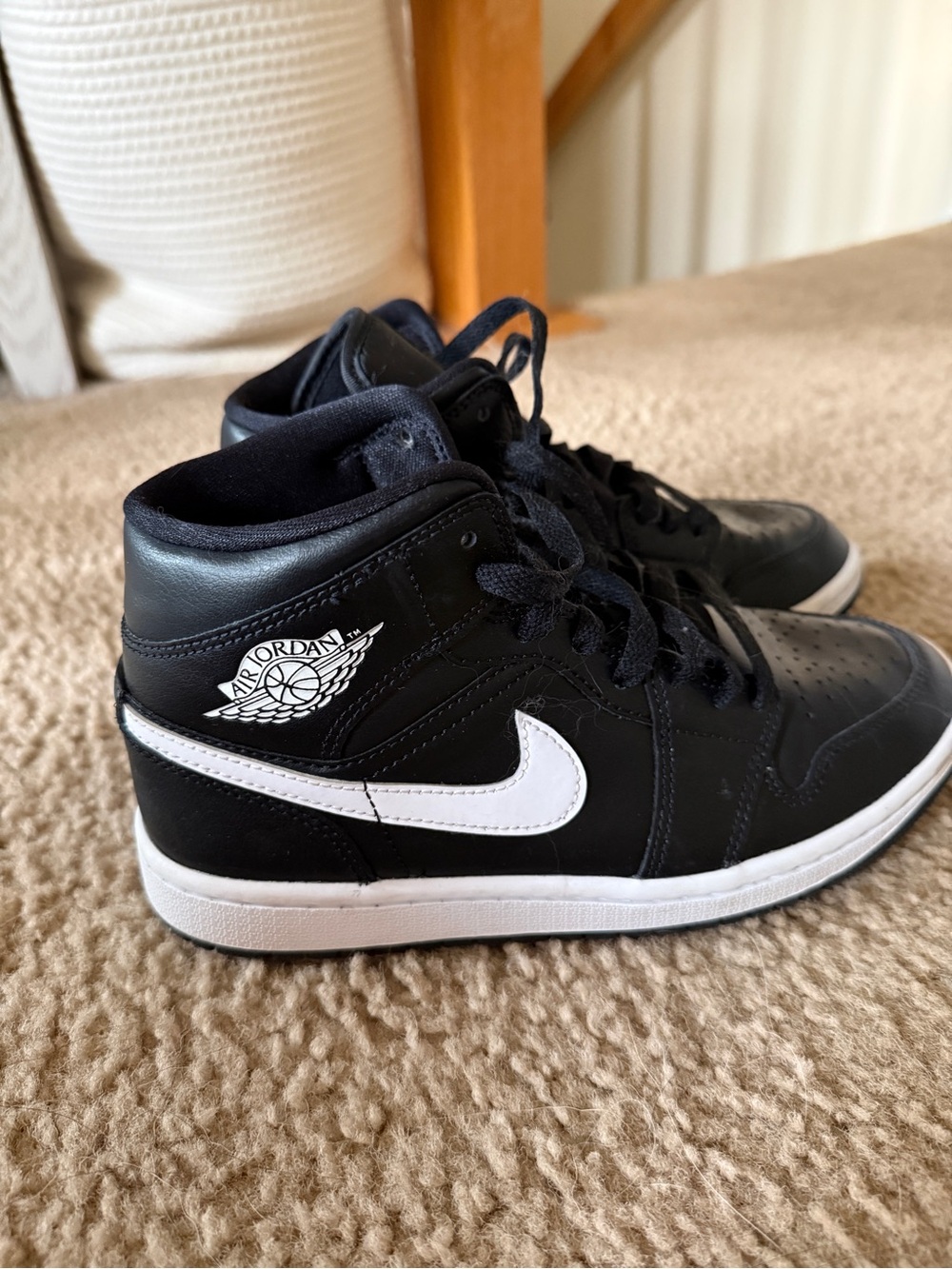Jordan Black and White Mid-Top Sneakers